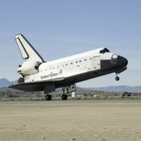Основната екипировка на Space Shuttle Endeavour се докосва до печат на плаката на пистата